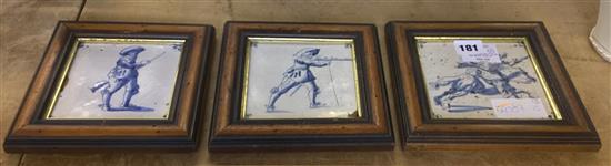3 18th century Delft blue and white tiles of figures holding muskets